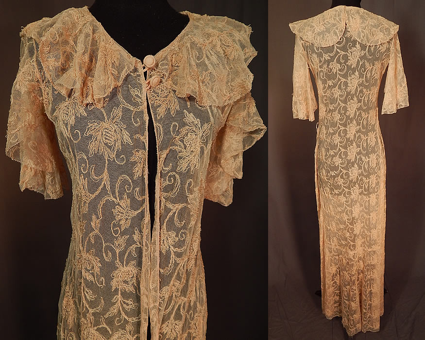 Vintage Blush Pink Tulle Net Tambour Embroidery Floral Lace Dressing Gown Robe
This lovely lace dressing gown boudoir robe has a long floor length, fitted style, with a scalloped shawl collar, short flared batwing sleeves, two fabric covered buttons at the neck, a single side snap closure at the waist and is sheer, unlined.