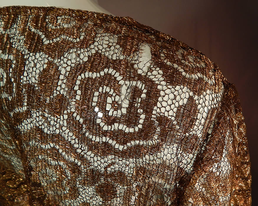 Vintage Art Deco Gold Metallic Lamé Lame Lace Crop Top Bolero Jacket Shrug
It is in good as-is condition with only a few small frayed breaks in the lace on the shoulders (see close-ups). This is truly a rare and exceptional piece of Art Deco wearable textile art!