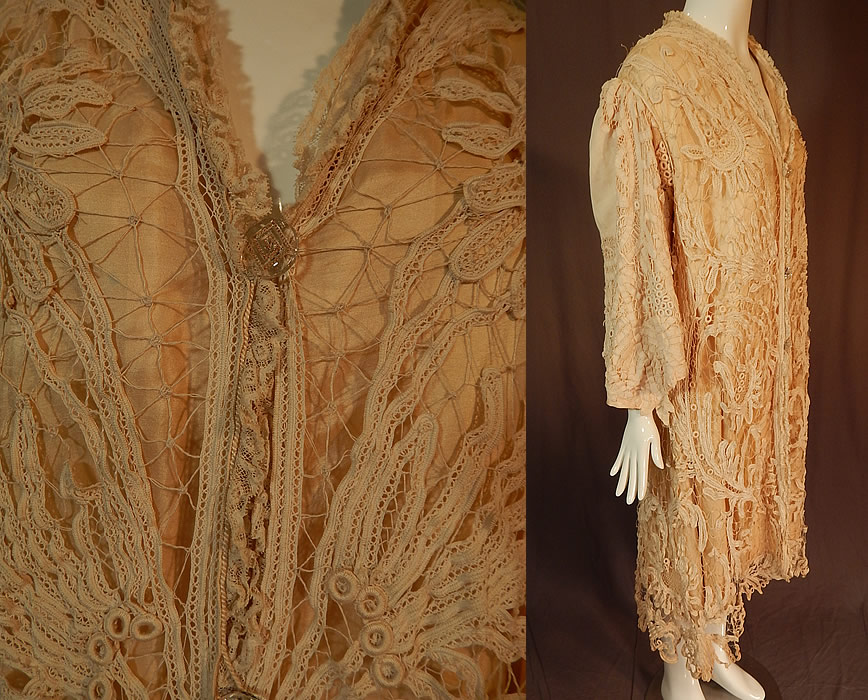 Edwardian Antique Cream Silk Lined Battenburg Tape Lace Long Coat Jacket
This lovely lace coat jacket is a long below the knee length, with a loose fitting style, gathered shoulders, long full sleeves with flared wide cuffs coming to a point, gold etched glass button closures down the front and is fully lined in a cream color silk satin backing lining. 