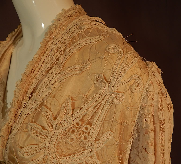 Edwardian Antique Cream Silk Lined Battenburg Tape Lace Long Coat Jacket
It is in good as-is condition, needing some restoration repairs, with several breaks in the lace and some fraying on the inside silk lining along the shoulders and neckline (see close-ups). 