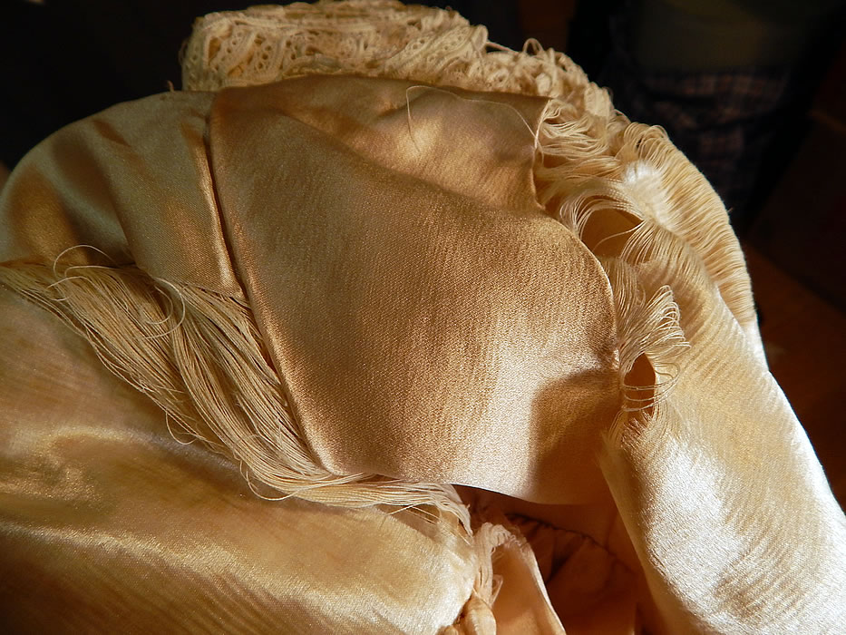 Edwardian Antique Cream Silk Lined Battenburg Tape Lace Long Coat Jacket
It is in good as-is condition, needing some restoration repairs, with several breaks in the lace and some fraying on the inside silk lining along the shoulders and neckline (see close-ups). 