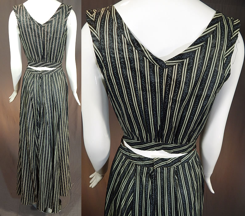 Victorian Blue & Black Striped Print Cotton Chintz Calico Dress Blouse Skirt
This womens work wear two piece day dress has a short crop over top style camisole sleeveless shirt blouse, with key hole cut out openings on the sides, an open front with a single hook closure on the fitted waistband and is unlined. The top measures 15 inches long, with a 34 inch bust and 24 inch waist.