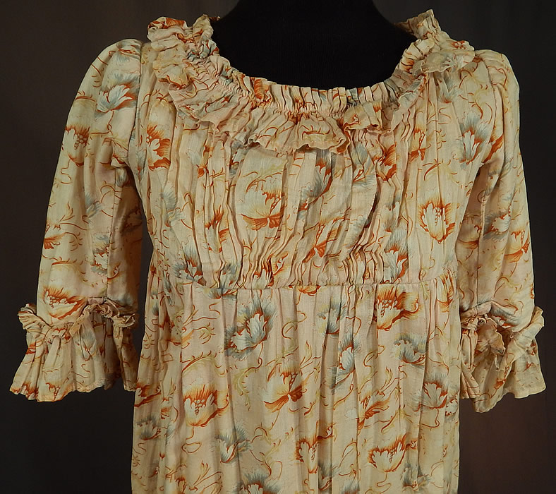 Victorian Girls Art Nouveau Floral Print Cotton Empire Waist Regency Style Dress
This young ladies Jane Austen Regency inspired dress has an empire silhouette fitted under the bust and falling loosely below, matching fabric ruched ruffle trim edging the neckline, sleeve cuffs and bottom skirt hemline, with hook closures on the back top and is lined in a cotton muslin fabric. 