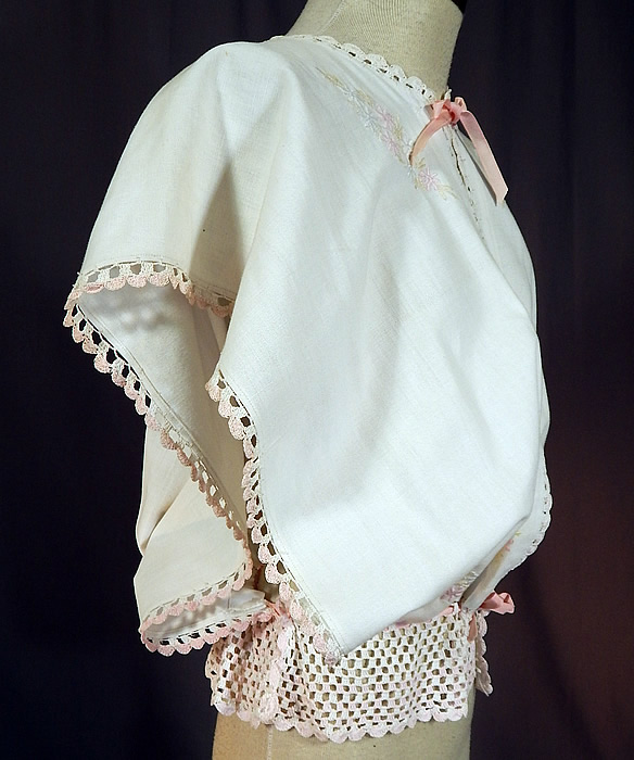 Edwardian White Linen Pastel Embroidered Crochet Lace Combing Bed Jacket
This beautiful boudoir bed combing jacket is loose fitting, with wide open sides, an open front with a pink ribbon tie closure at the neck and drawstring waist. 