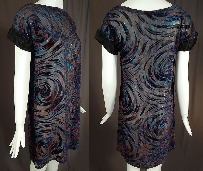 Vintage Blue Burnout Voided Velvet Devore Silk Chiffon Swirl Print Tunic Top Dress
This fabulous flapper dress has a short tunic top, loose fitting straight shift style, black silk trimmed short cap sleeves and is sheer, unlined.