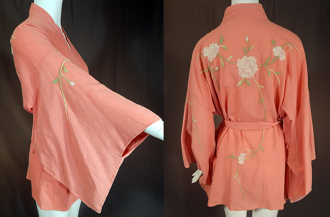 Vintage Japanese Pink Peony Floral Embroidered Muslin Belted Kimono Robe
This pretty pink Japanese kimono short robe jacket has an open front with a matching fabric sash tie belt for closure, full kimono sleeves and is unlined. The kimono measures 30 inches long, with a 48 inch chest, 48 inch waist, 25 inch back and 53 inch long sash belt.