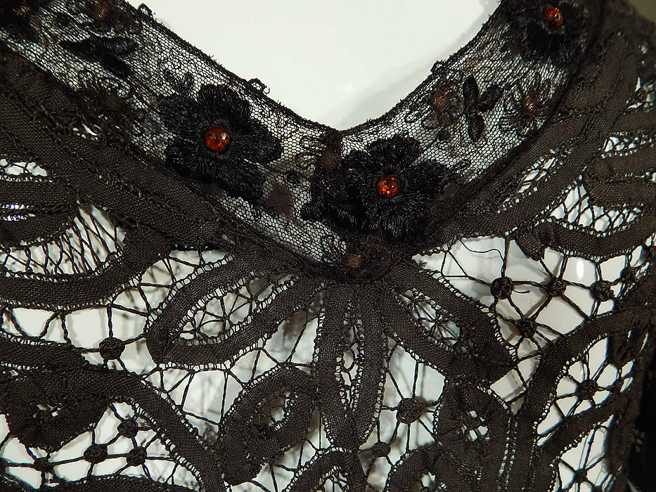 Edwardian Antique Black Battenburg Tape Lace Amber Beaded Gown Dress
The dress measures 64 inches long in the front, 72 inches long in the back, with a 36 inch bust, 23 inch waist, 54 inch hips and 15 inch back. It is in good condition, with some gathered, layering of the lace fabric on one side of the top. This is truly an exceptional piece of antique lace wearable art! 