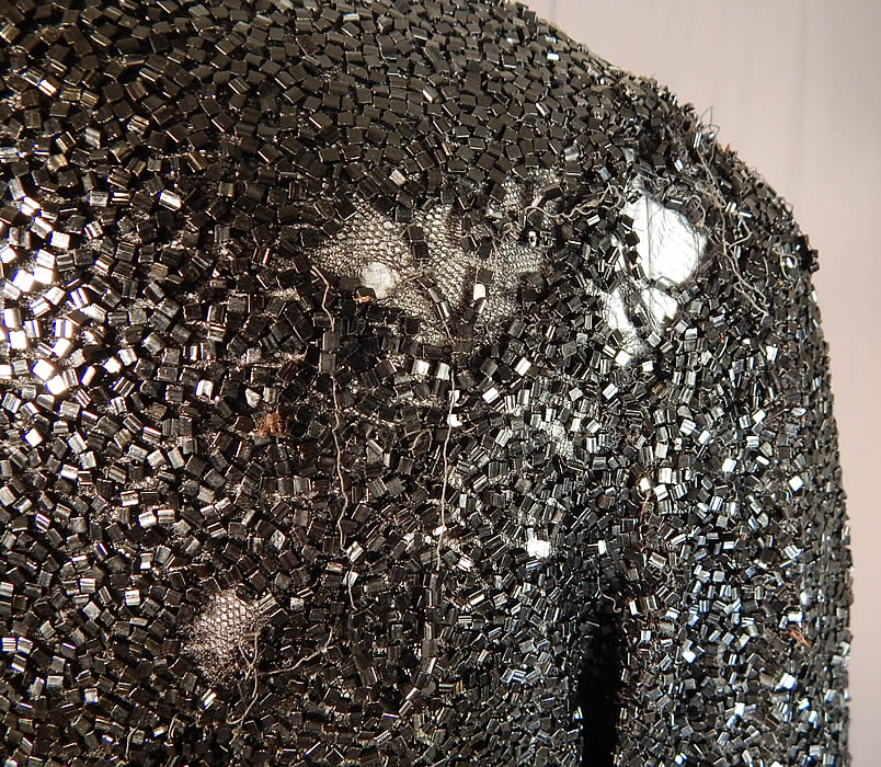 Vintage Art Deco Fully Black Beaded Flapper Evening Coat Crop Bolero Jacket
The jacket measures 23 inches long, with a 40 inch bust, 32 inch waist, 13 inch back, 15 inch long sleeves and is quite heavy weighing 4 pounds. 