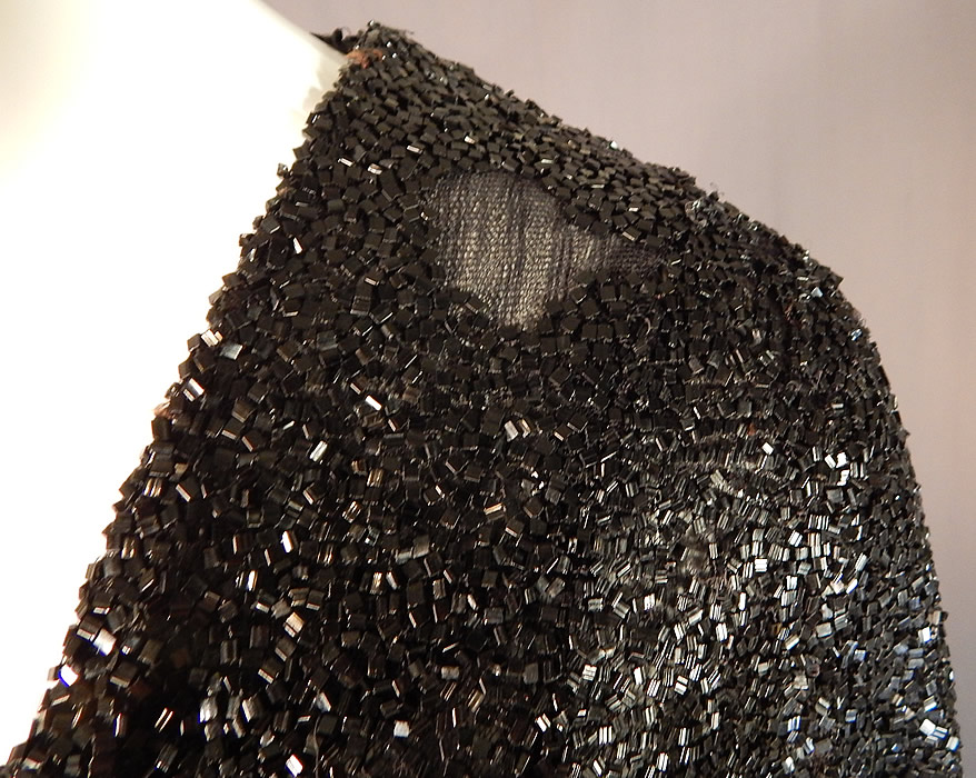Vintage Art Deco Fully Black Beaded Flapper Evening Coat Crop Bolero Jacket
It is in good as-is condition, needing some restoration on the back shoulder with a small frayed hole and some loose, missing beads mostly on the one shoulder area (see close-ups).