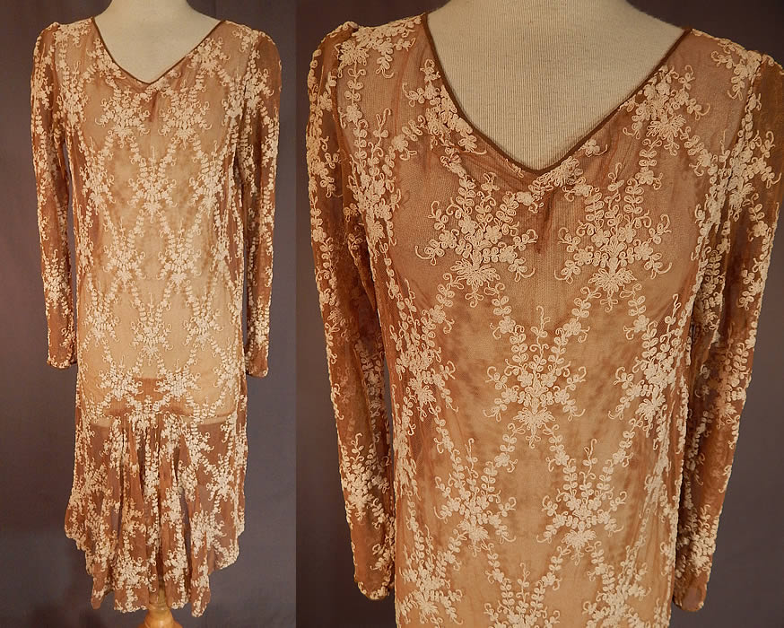 Vintage Ecru Beige Tulle Net Tambour Embroidery Lace Drop Waist Dress
This vintage ecru beige tulle net tambour embroidery lace drop waist dress dates from the 1920s. It is made of an ecru beige color sheer tulle net fabric with off white cream color tambour embroidery work of a floral vine leaf lace pattern design.