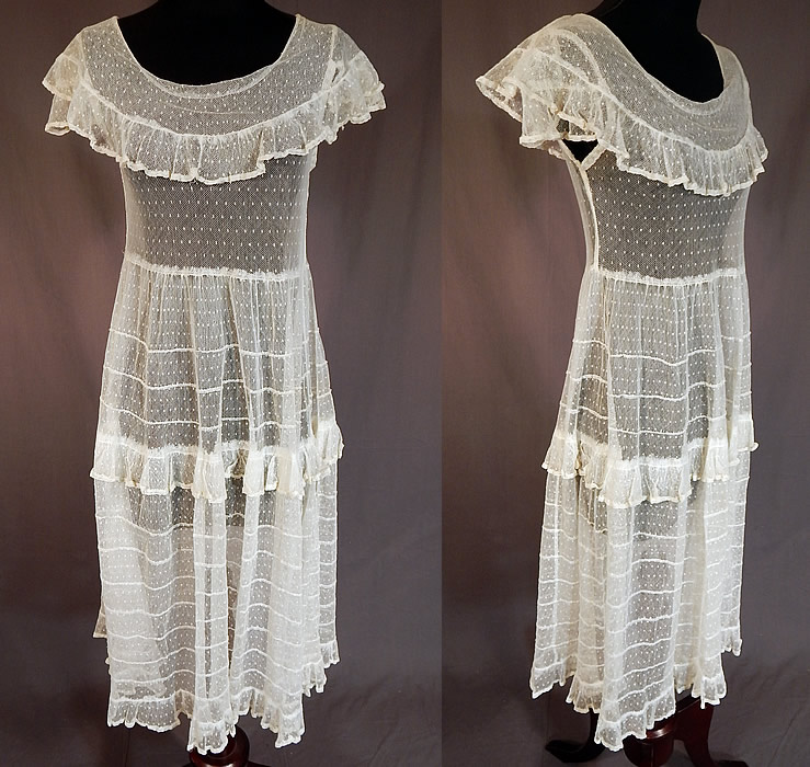 Vintage Swiss Polka Dot White Tulle Net Lace Shawl Collar Capelet Dress
This vintage Swiss polka dot white tulle net lace shawl collar capelet dress dates from the 1930s. It is made of a white sheer tulle net fabric with a woven Swiss dot, polka dot pattern and pleated ruffle trim edging.