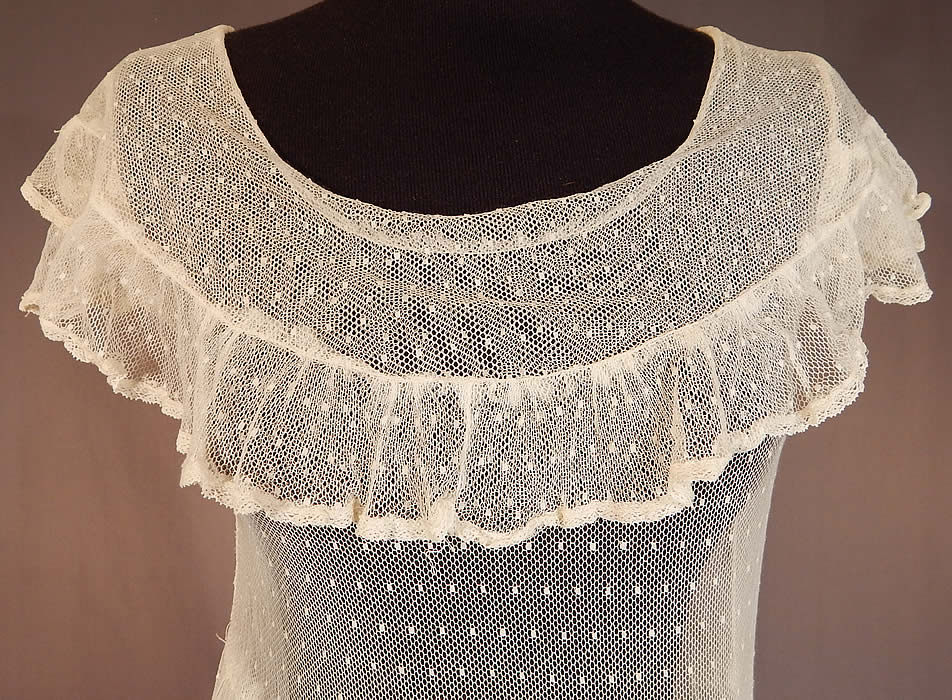 Vintage Swiss Polka Dot White Tulle Net Lace Shawl Collar Capelet Dress
This lovely lace adolescent, youth size dress has a shawl style collar capelet, cap sleeves, a fitted waist, ruffle trim edge skirt and is sheer, unlined.