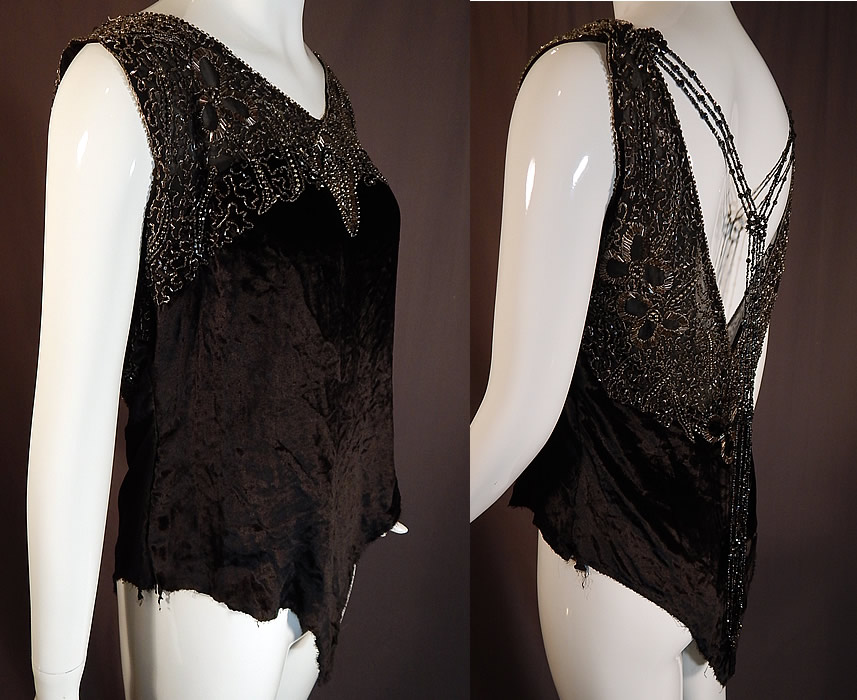 Vintage Art Deco Black Velvet Silver Studded Beaded Fringe Flapper Blouse Top
This fabulous flapper dress blouse top has a loose fitting, sleeveless style which comes to a V point on the bottom, has a sexy low plunging V back with beaded necklace strands of fringe trim attached on the shoulders and hanging loosely down the back.