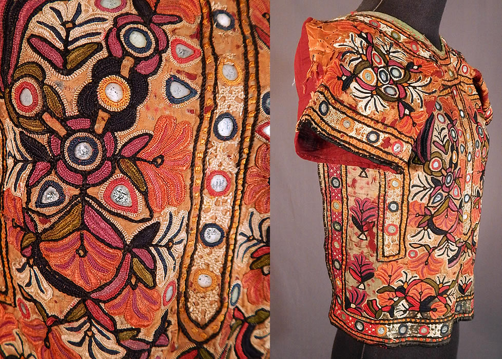 Vintage Indian Gujarat Kutch Work Embroidery Mirrorwork Choli Boho Blouse Top
It is hand stitched, made a hand dyed fine silk fabric sewn onto and backed with a dark red burgundy color cotton twill woven fabric, with colorful kutch embroidery work, chain stitching and buttonhole stitching surrounding small glass mirrors creating an ethnic floral design.
