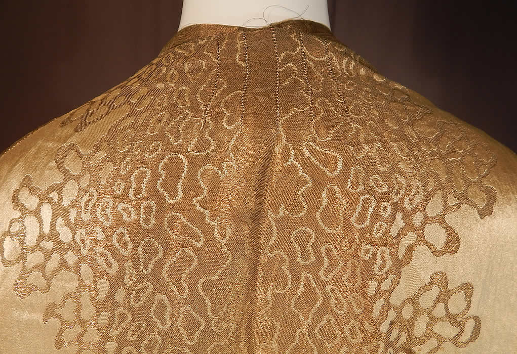 Vintage Art Deco Applique Pattern Gold  Lame Long Flapper Coat Jacket
The coat measures 34 inches long, with a 44 inch bust, 44 inch waist, 44 inch hips, 24 inch long sleeves and a 14 inch back.
