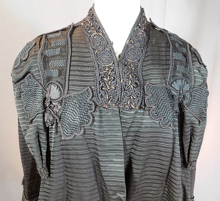 Edwardian Black Silk Soutache Braided Rope Passementerie Trim Long Evening Coat
This antique Edwardian era black silk soutache braided rope passementerie trim long evening coat dates from 1910. It is made of a heavy black silk grosgrain ribbed textured fabric, with black silk soutache braided rope, woven passementerie trim accents. 