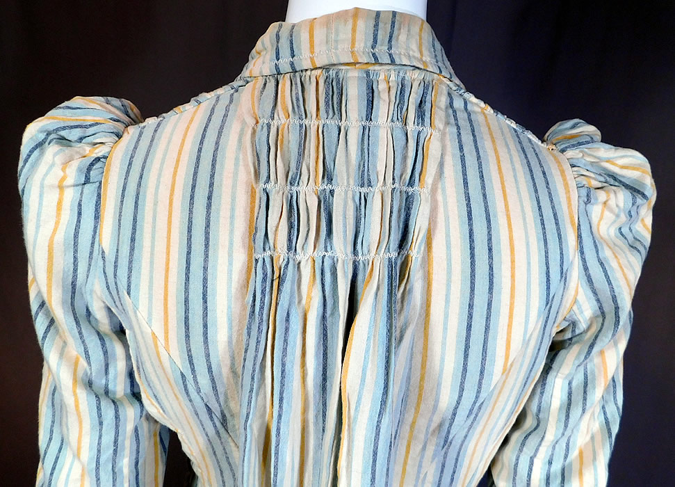 Victorian Striped Print Flannel Wool Watteau Wrapper Workwear Morning Dress
It is in good as-is condition, with a few tiny moth holes on the skirt, some faint soiling, stains on the inside back collar and inside cotton lining top.