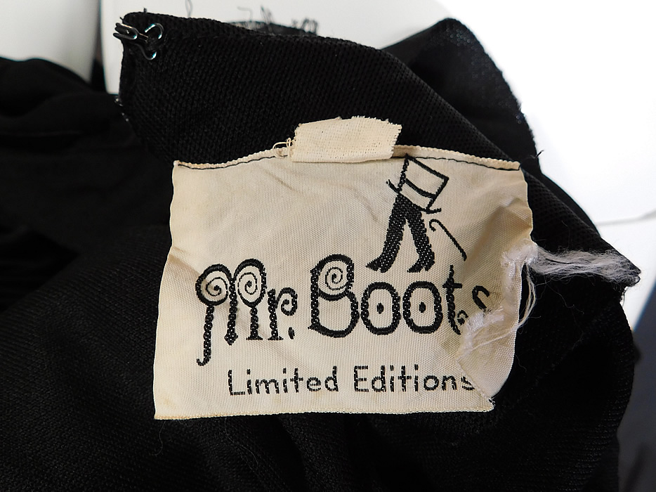 Vintage Mr. Boots Limited Editions Black Knit Neon Butterfly Mod Maxi Dress
There is a "Mr. Boots Limited Editions" label and size 5 tag sewn inside. The dress measures 56 inches long, with a 36 inch bust, 26 inch waist, 36 inch hips, 22 inch long sleeves and a 14 inch back. It is in good condition. This is truly a wonderful piece of retro mod hippie wearable art! 