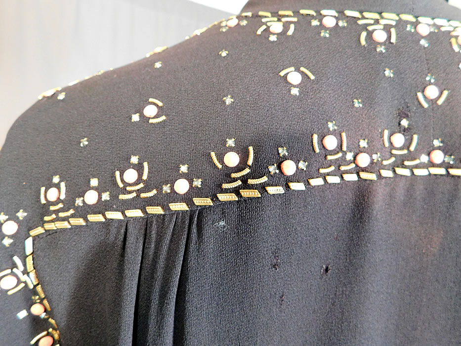 Vintage Black Silk Charmeuse Gold Studded Coral Rhinestone Beaded Cocktail Dress
It is in good as-is condition, with a three tiny pin holes and a small faded discoloration spot on the back top (see close-ups). 