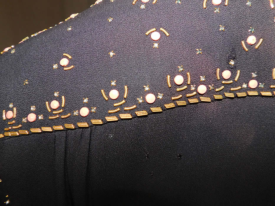 Vintage Black Silk Charmeuse Gold Studded Coral Rhinestone Beaded Cocktail Dress
It is in good as-is condition, with a three tiny pin holes and a small faded discoloration spot on the back top (see close-ups). 