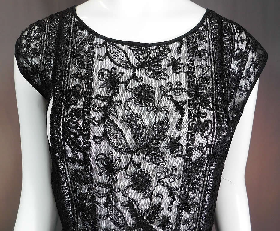 Vintage Black Net Tambour Embroidery Lace Tabard High Slit Chemise Shift Dress
This lovely lace chemise tabard style shift dress is loose fitting, has open cut out split panels stitched together at the waist, with high slits along the skirt sides, sleeveless and is sheer, unlined.