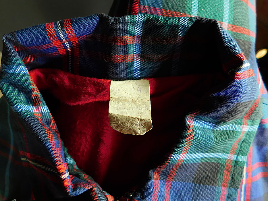 Vintage Childs Cotton Plaid Tartan Boys Retro Rockabilly Ricky Jacket
This retro rockabilly Ricky style child's jacket has a zipper front closure, long sleeves, front side slit pockets, elastic side gathering on the waist and is fully lined in a red soft flannel fabric with a size 4 tag sewn inside.