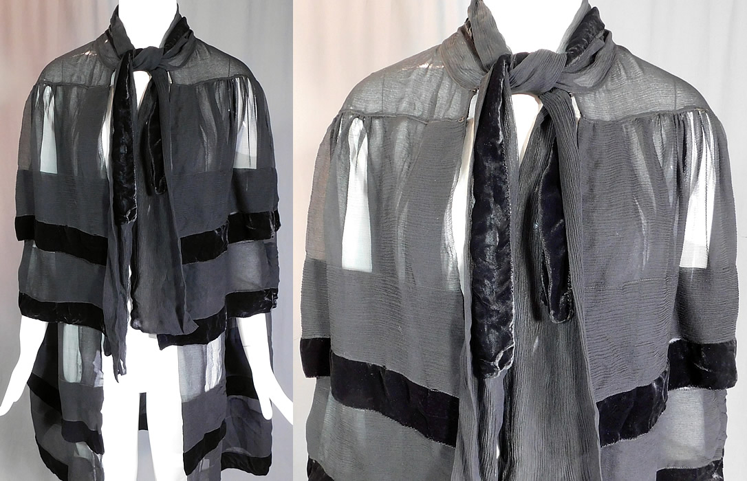 Vintage Art Deco Black Silk Chiffon Velvet Trim Flapper Evening Cloak Cape
This vintage Art Deco black silk chiffon velvet trim flapper evening cloak cape dates from the 1920s. It is made of a black sheer silk crepe chiffon fabric with black velvet trim edging. This fabulous flapper evening cloak cape is a long mid length, with a layered tiered capelet style, side arm hole opening slits, a scarf tie closure at the neck and is sheer, unlined.