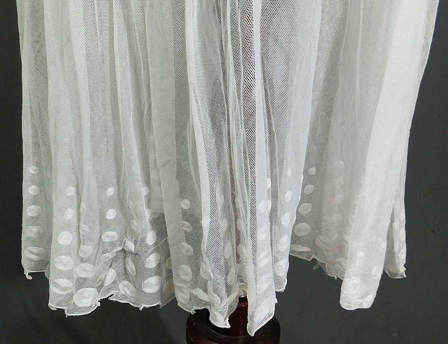 Vintage Polka Dot Embroidered White Tulle Net Pleated Shift Drop Waist Dress
This pretty polka dot, striped geometric drop waist dress has a straight shift style, with a crochet lace trim neckline, short sleeves, a flared bottom short skirt with dentil ornamental scalloped trim edging, tiny button closures on the shoulder and is sheer, unlined. 