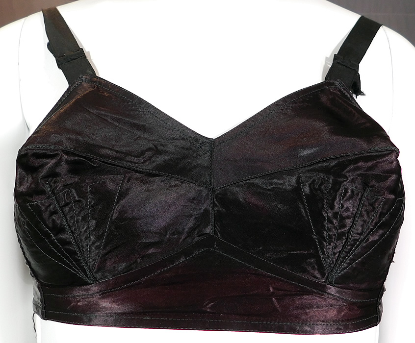Vintage Quest-Shon Mark Black Silk Satin Stitched Cup Conical Cone Brassiere Bullet Bra
It is made of a black silk satin fabric with decorative mermaid fin, sea shell stitching conical cone shape cups.