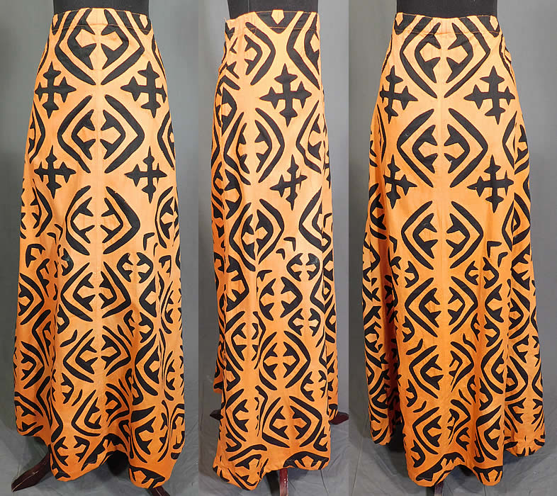 Vintage Antique Hawaiian Applique Quilt Cutout Fabric Boho Hippie Maxi Skirt
This vintage antique Hawaiian applique quilt cutout fabric boho hippie maxi skirt dates from the 1960s. It is made of an orange and black cotton fabric with a cutout background hand stitched applique work creating a radially symmetric pattern bold design distinctive of the quilting styles of the Hawaiian islands. This beautiful boho style maxi skirt is a long floor length, with side zipper closure and is unlined.