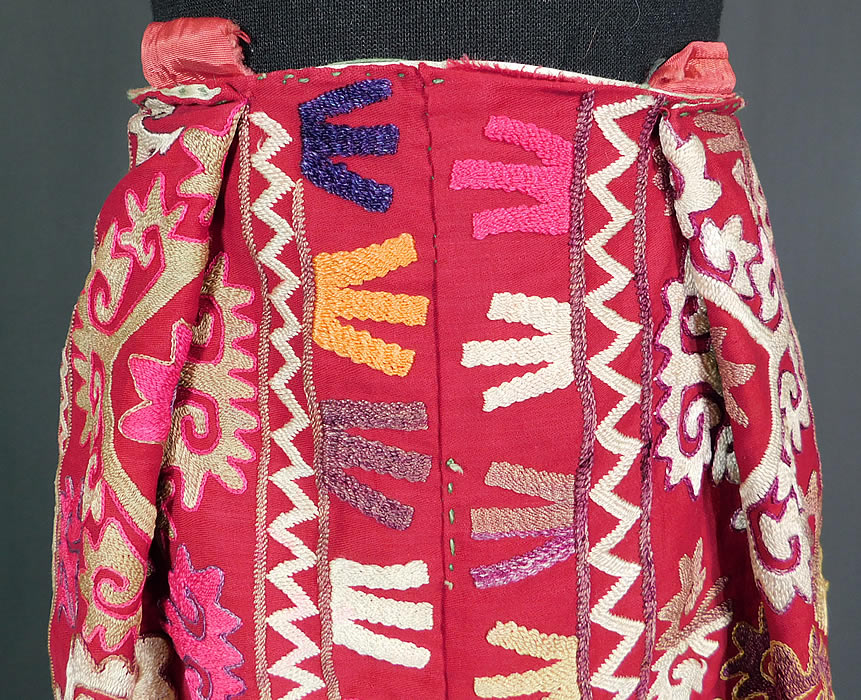 Vintage Antique Uzbekistan Suzani Embroidered Tribal Textile Half Apron Skirt
This unique Uzbekistan Suzani has been pieced together created into a half apron skirt style, with pleating on the top front, an attached tie strap closure on the back and is fully lined in a white silk satin fabric. 
