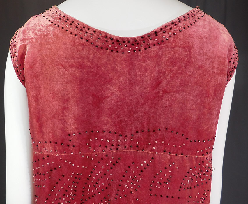 Vintage Art Deco Pink Velvet Black Beaded Flapper Sleeveless Shift Dress
The dress measures 41 inches long, with a 40 inch bust, 42 inch waist and 42 inch hips. 