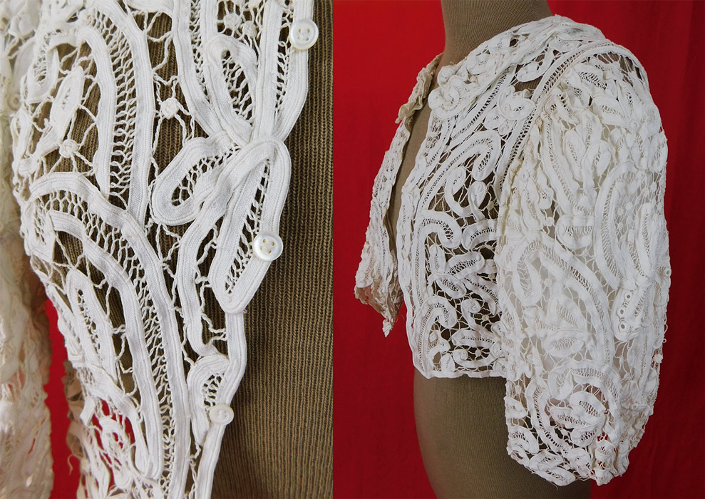 Victorian White Battenburg Tape Lace Short Crop Bodice Blouse Bolero Jacket
This lovely lace bodice blouse has a short cropped bolero jacket style with an open front, tiny mother of pearl button closures, 3/4 length full puffy sleeves, a rounded fold over collar and is sheer unlined. 