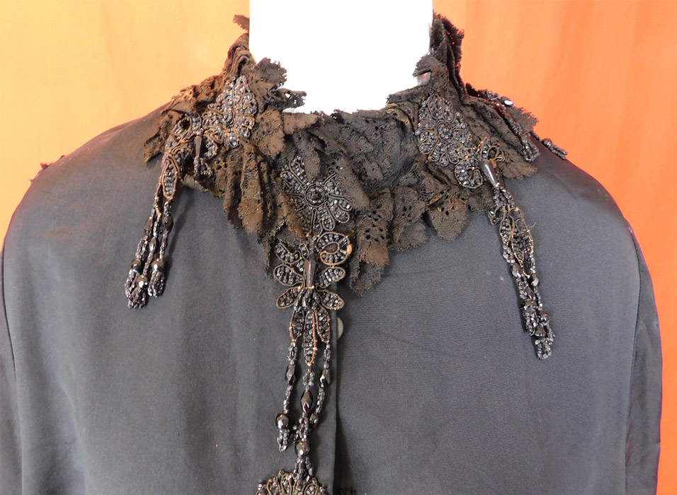 Victorian Black Silk Jet Beaded Fringe Tassel Trim Dolman Mantle Cloak Cape
The mantle measures 35 inches long, with a 42 inch chest, 14 inch back and 16 inch neck.