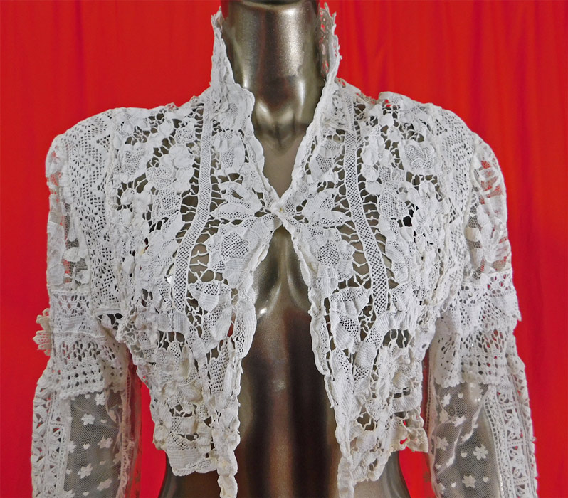 Vintage Victorian Style Point de Venise Needle Lace White Patchwork Short Bolero Jacket 
The jacket measures 15 inches long, with a 40 inch chest, 25 inch long sleeves and a 17 inch back.