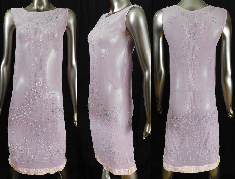 Vintage Art Deco Lilac Pink Sheer Silk Chiffon Crystal Beaded Flapper Dress
This lovely lilac flapper dress has a straight loose fitting shift style, sleeveless, with pink pleated gathering voided velvet devore fabric trim edging along the bottom hem and is sheer, unlined