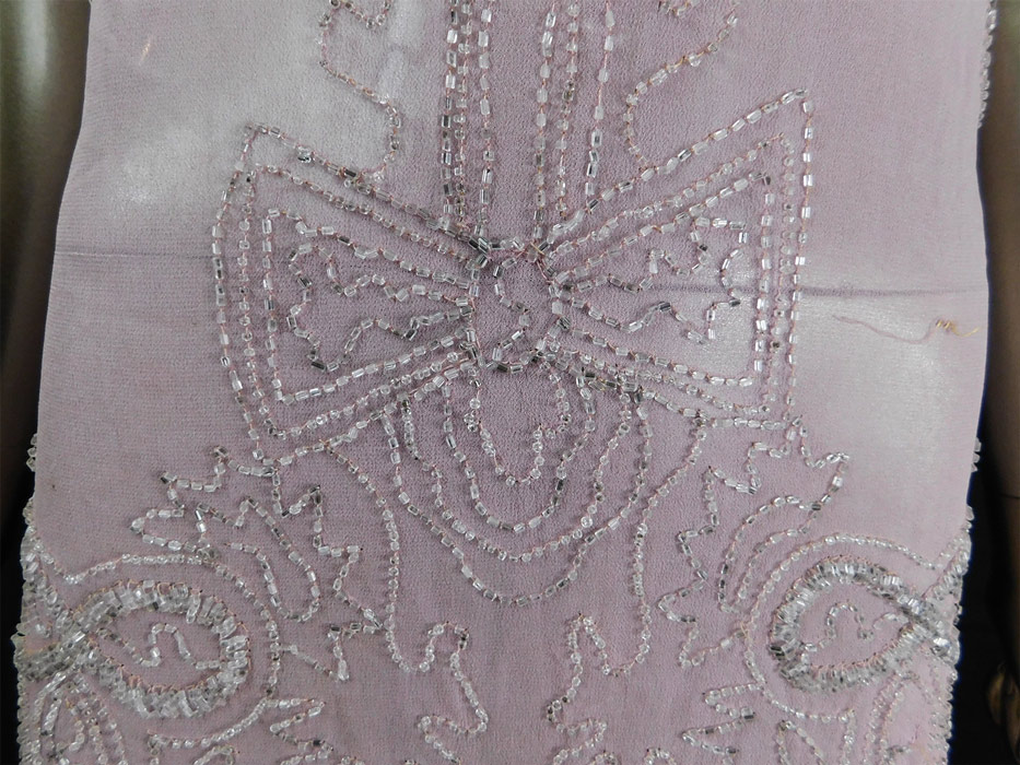 Vintage Art Deco Lilac Pink Sheer Silk Chiffon Crystal Beaded Flapper Dress
It is made of a pale purple pink lilac color sheer silk chiffon fabric, with crystal beaded decorative designs. 