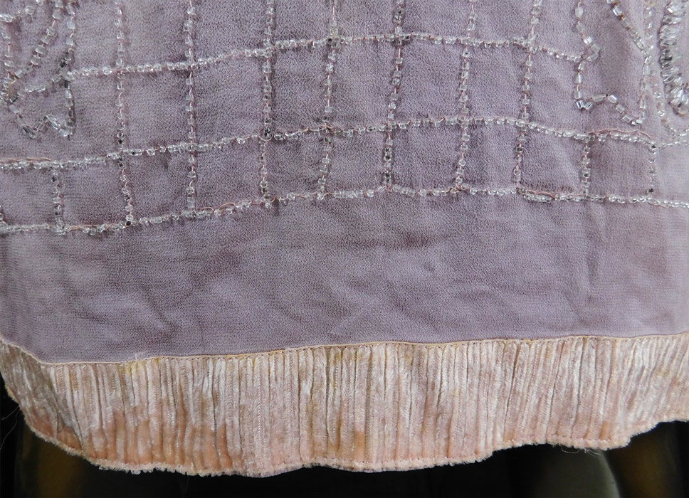 Vintage Art Deco Lilac Pink Sheer Silk Chiffon Crystal Beaded Flapper Dress
This vintage Art Deco lilac pink sheer silk chiffon crystal beaded flapper dress dates from the 1920s.