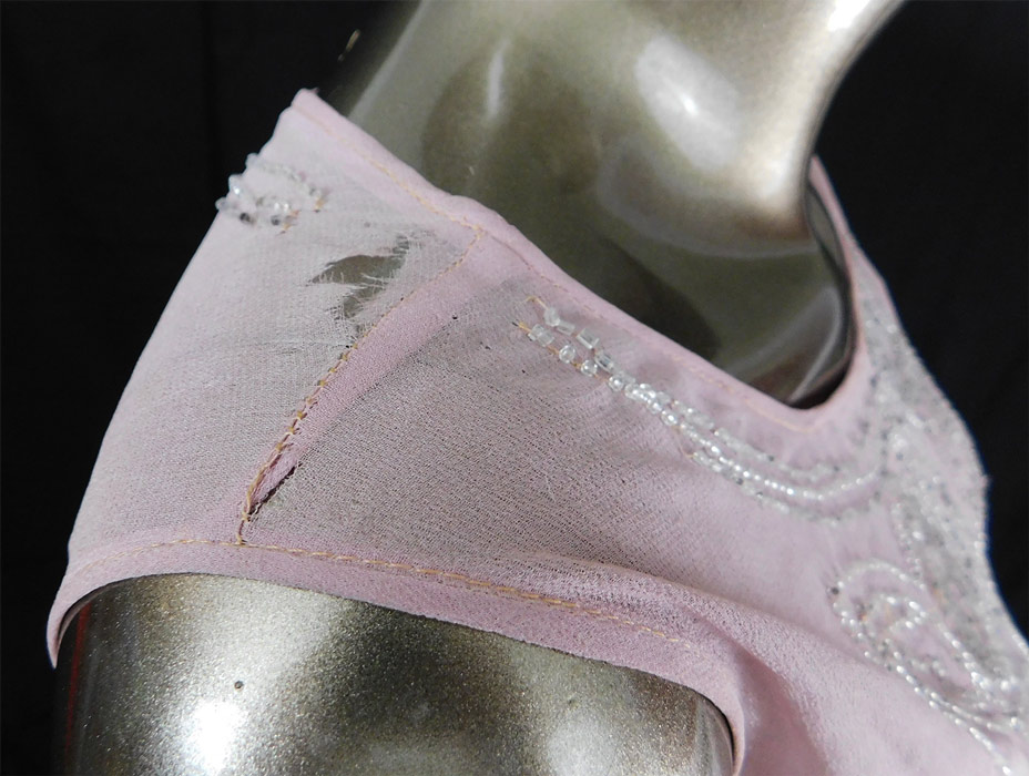 Vintage Art Deco Lilac Pink Sheer Silk Chiffon Crystal Beaded Flapper Dress
It is in fair as-is condition, needing some restoration repairs, with some loose missing beads, faint underarm discoloration and small frayed holes on both shoulders (see close-ups).