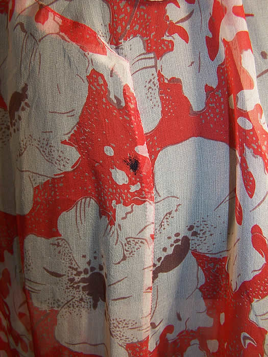 Orange Poppy Chiffon Bias Cut Dress Feather Jacket Close up.