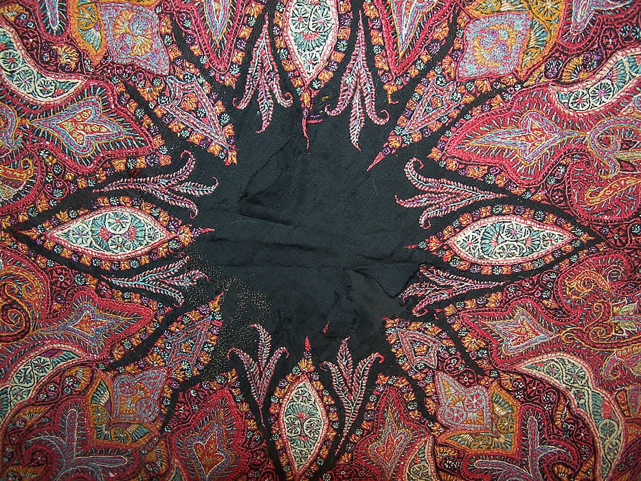 Antique Victorian Kashmir Hand Woven Embroidered Pieced Paisley Shawl with several frayed rips in the black wool center which has been mended and patched on the back 