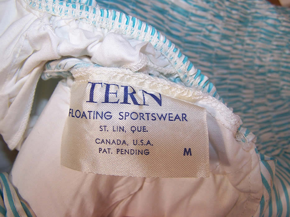 Unworn Vintage Tern Floating Sportswear Pinup Green White Striped Swimsuit label close up.