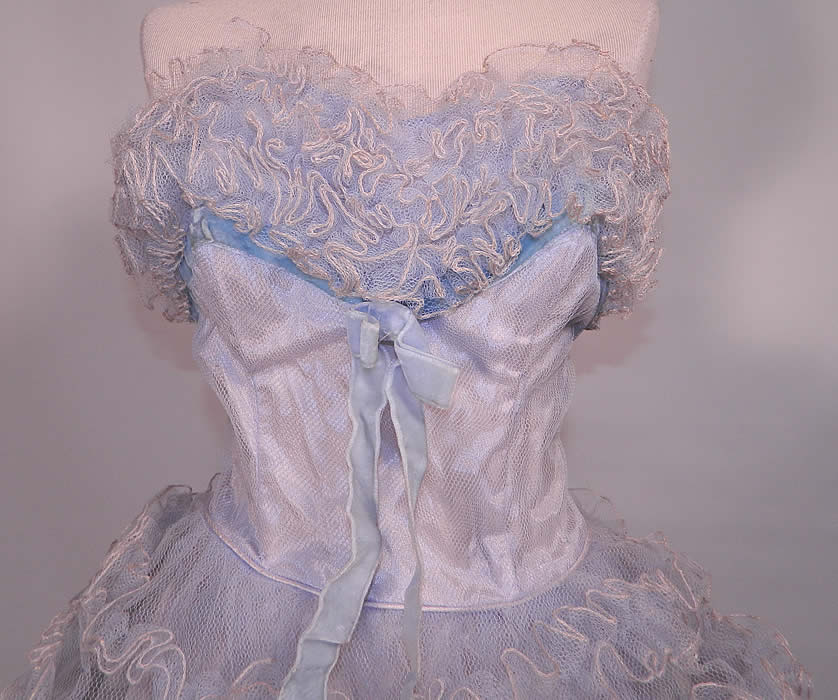 Vintage Baby Blue Ruffle Tulle Net Strapless Formal Cupcake Dress. There is a blue velvet ribbon and bow trim on the front bustline and a pink rose flower trim on the side skirt.