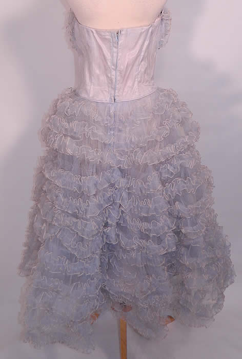 Vintage Baby Blue Ruffle Tulle Net Strapless Formal Cupcake Dress. There are stays boning sewn inside the bodice lining and a side zipper closure. The dress measures 40 inches long, with a 26 inch waist and 38 inch bust. It is in good condition. This is truly a wonderful piece of wearable art! 