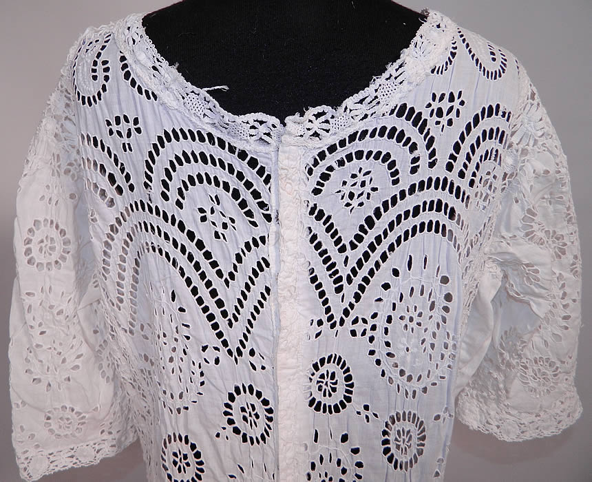 Edwardian White Cotton Batiste Eyelet Lace Large Size Graduation Tea Dress. The dress is a large size measuring 55 inches long, with 40 inch hips, a 34 inch waist, 40 inch bust, 17 inch back and 12 inch long sleeves. It is in good condition. This is a wonderful piece of romantically feminine Edwardian antique textile art which could be worn as a wedding gown or graduation dress.