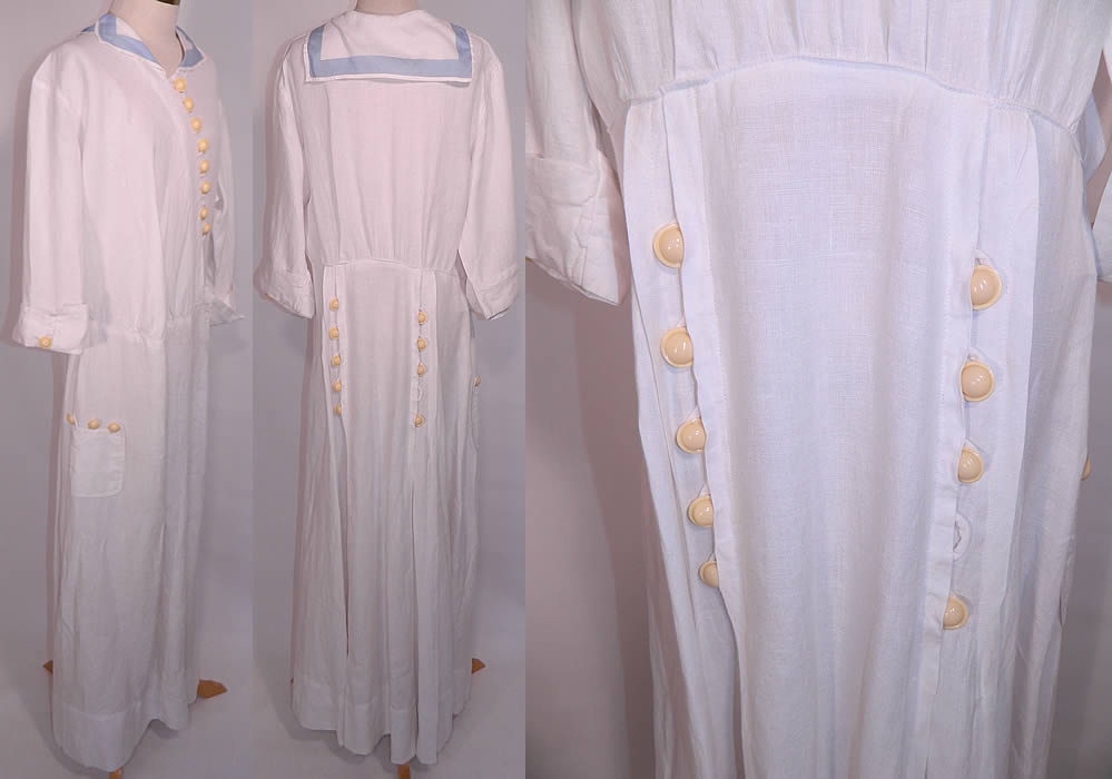 Edwardian White Linen Blue Middy Sailor Collar Large Size Workwear Day Dress. It is made of a fine white linen fabric, with a light blue trim edging the collar and round celluloid button trim. This wonderful workwear women's summer day dress is loose fitting, a long floor length, with a middy top style sailor collar, asymmetrical button front closures, 3/4 length sleeves with rolled cuffs, a side skirt pocket and button trim pleated back skirt. The dress is a large size measuring 55 inches long, with 44 inch hips, a 34 inch waist, 44 inch bust, 16 inch back and 16 inch long sleeves.