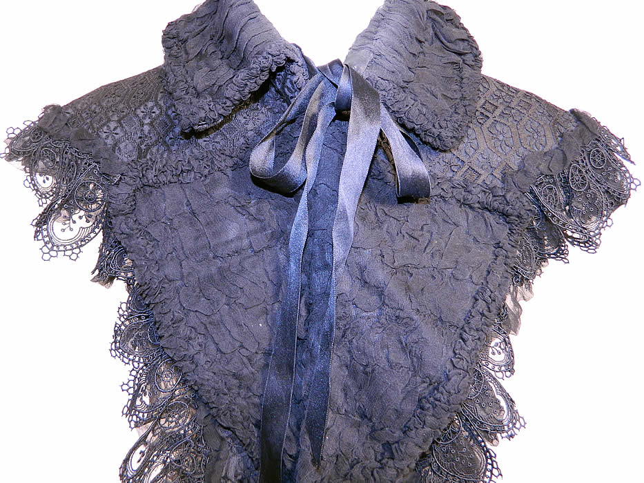 Victorian Antique Black Silk Lace Dolman Mantle Cape Capelet Collar. This beautiful black lace small dolman mantle style cape capelet has a fold up high neck collar, ribbon and hook closure at the neck, long lappet panel front and is fully lined in black silk.