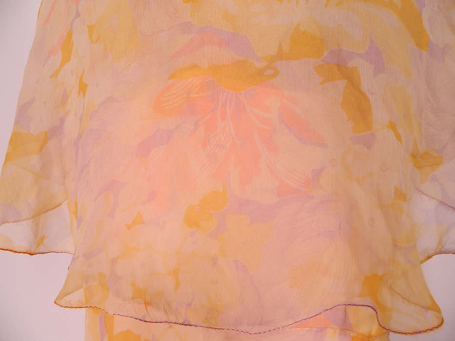 Vintage Pastel Silk Chiffon Floral Print Shawl Collar Bias Cut Dress. The dress measures 58 inches long, with 36 inch hips, a 28 inch waist and 36 inch bust. It is in good condition. This is truly a wonderful piece of wearable art.