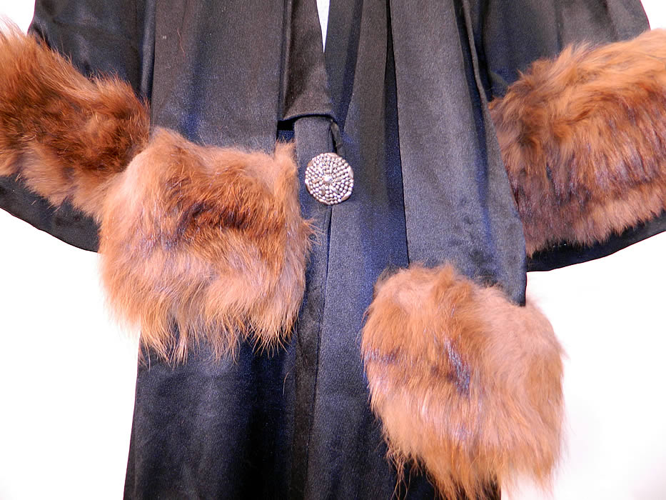 Vintage Art Deco Black Silk Fur Trim Evening Cocoon Opera Coat Jacket. The coat measures 42 inches long, with 42 inch hips, waist, bust and 23 inch long sleeves. It is in good condition and is truly a wonderful piece of Art Deco wearable art