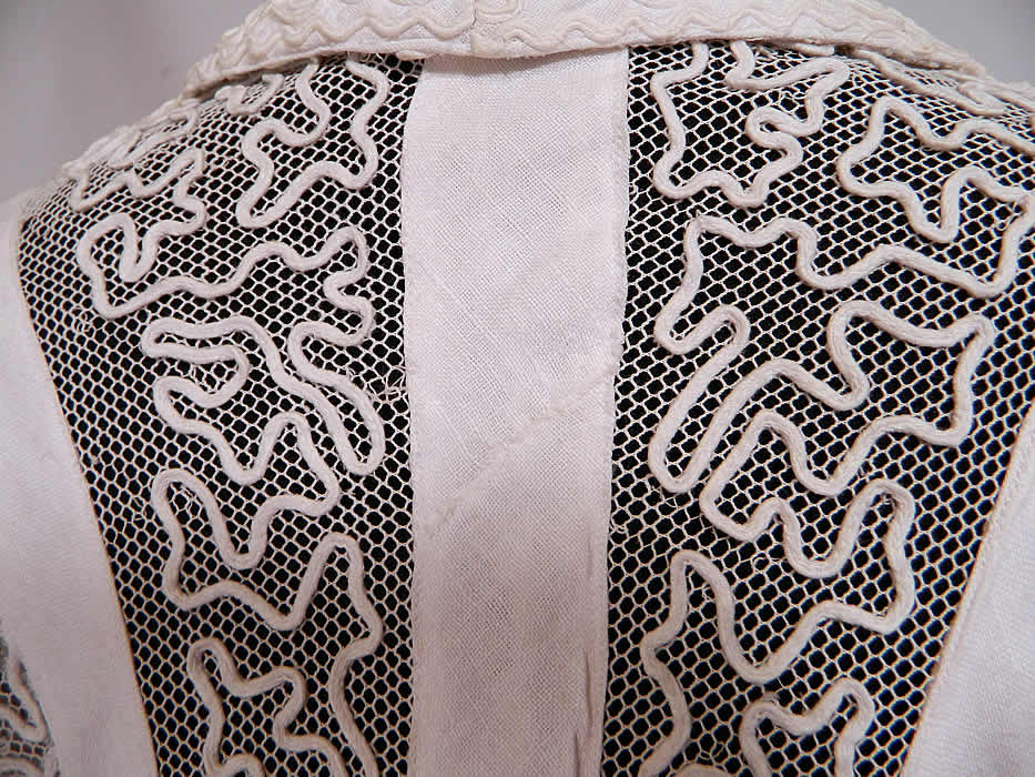 Edwardian White Linen Net Soutache Work Walking Suit Dress Jacket & Skirt. It is in good condition, has not been cleaned, with only a small mended repair on the jacket back linen strip panel which is barely noticeable. This exquisite antique Edwardian Titanic era white linen net soutache work walking suit dress jacket and skirt dates from 1912. 